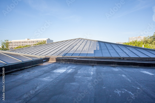 an flat roof on a high building
