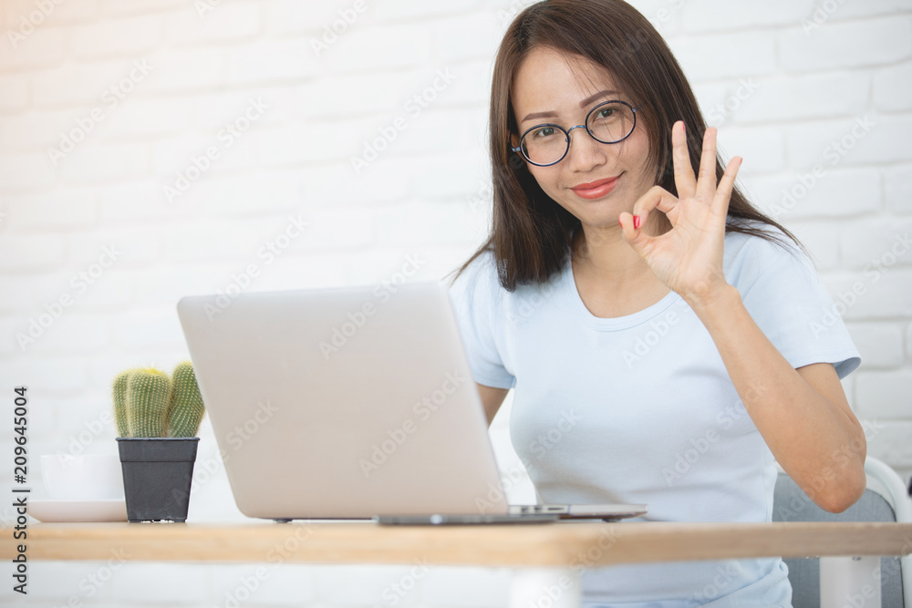 Young asian business woman working with laptop computer . Young asian business woman working with laptop computer .