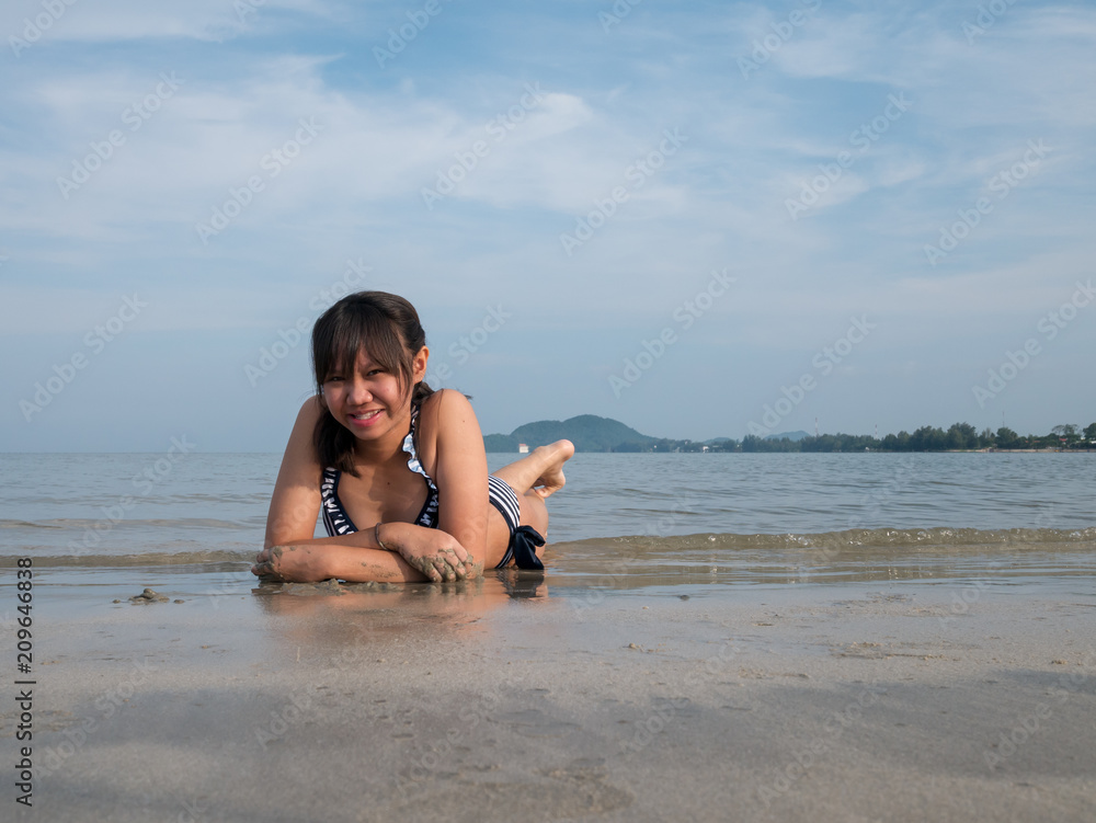 Teenage wearing bikini at the beach. Teenage wearing bikini at the beach.