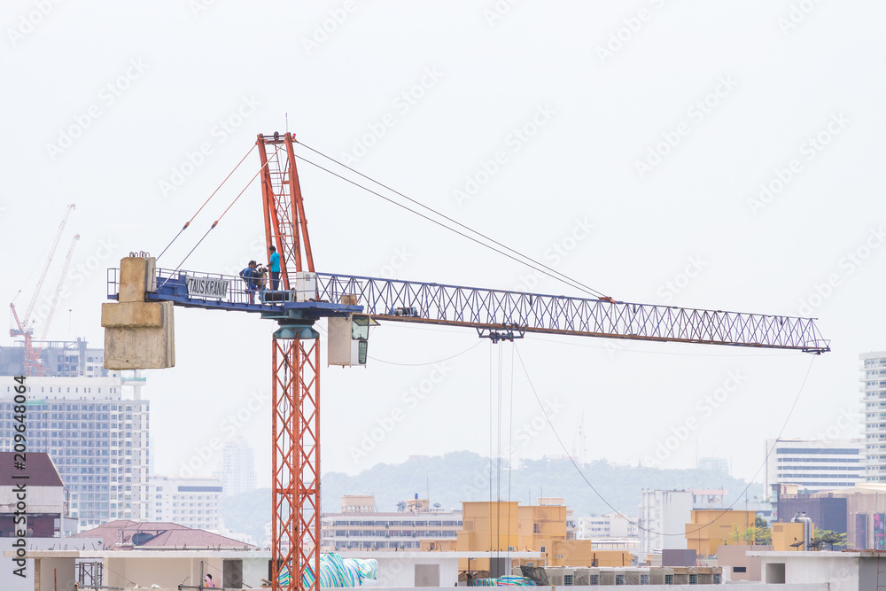 Construction crane, building construction using modern machinery