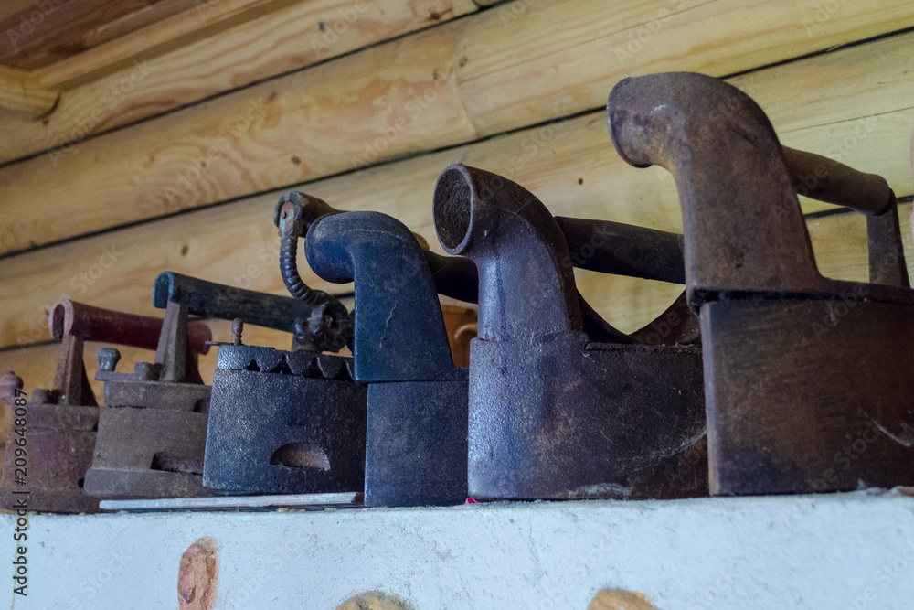 Old clother irons are decoration of old house Old clother irons are decoration of old house