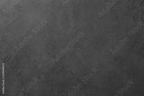 Black board or black stone background texture. Copy space for text. Design background or template