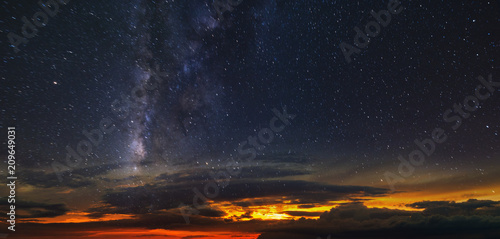 Panorama of the starry sky over the red horizon
