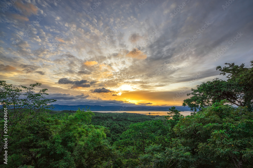 Panoramic view and colorful nature landscape and ray of sunlight through clouds at sunrise, view from the top view of mountains.