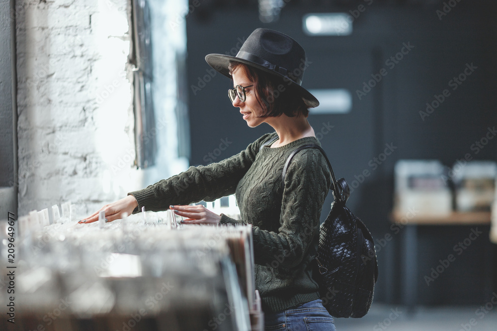 Young girl browsing records