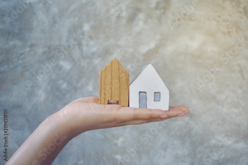 House in hand close-up.on bright background