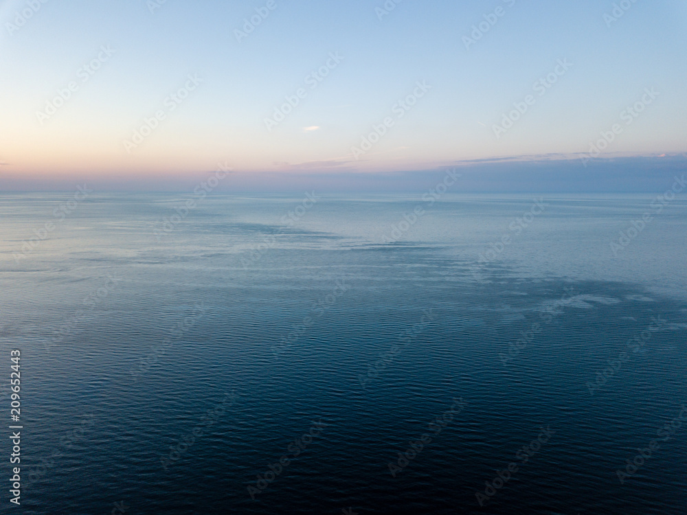 drone image. aerial view of red sunset in the sea. shore line