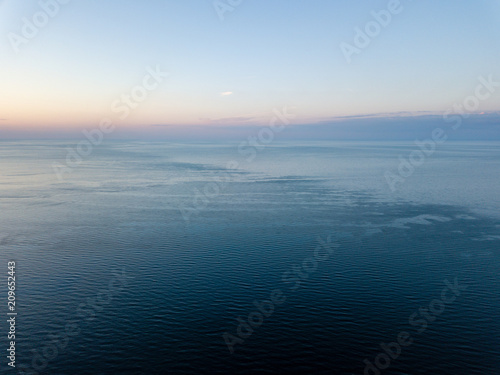 drone image. aerial view of red sunset in the sea. shore line © Martins Vanags