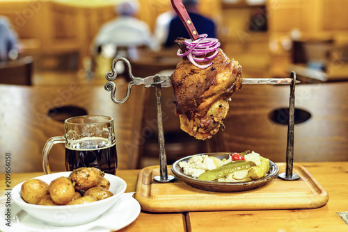 Canvas Print Baked pork meat with beer and vegetables