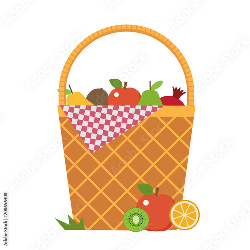 Wicker vegetable basket with blanket. Opened picnic food hamper with vegetables and fruits.