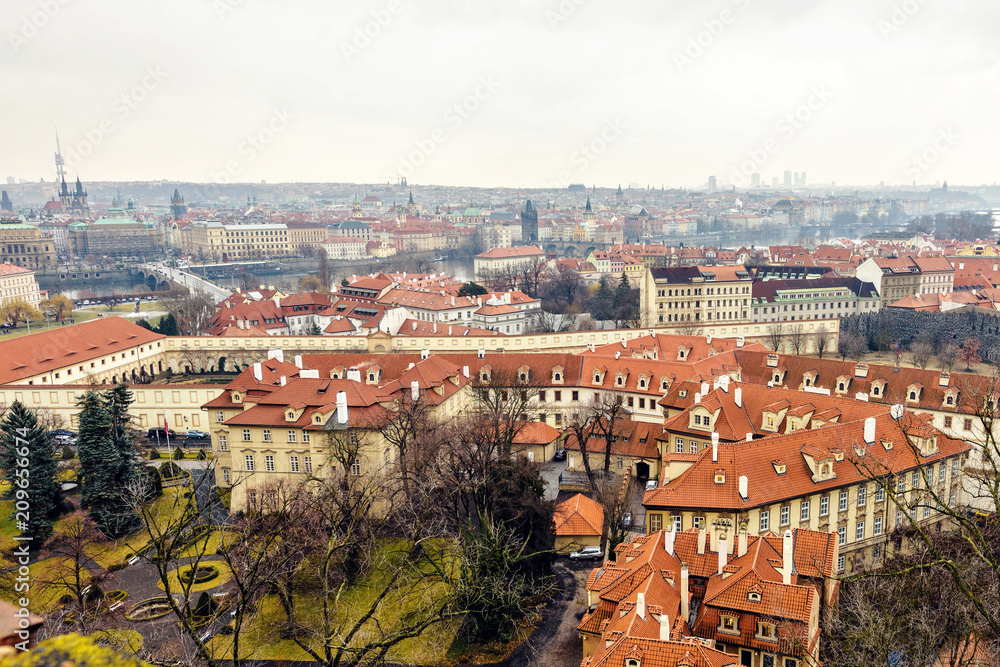 Cloudy day aerial view to clay pot roofs of Prague