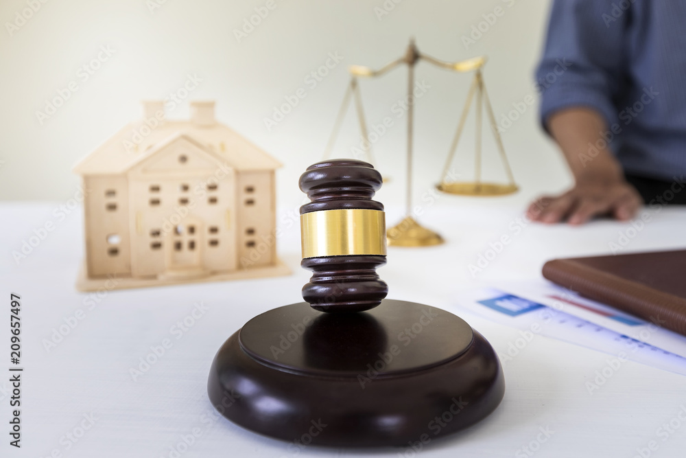 Judge gavel with lawyer bakground. Concepts of housing and real estate law. Judge gavel with lawyer bakground. Concepts of housing and real estate law.
