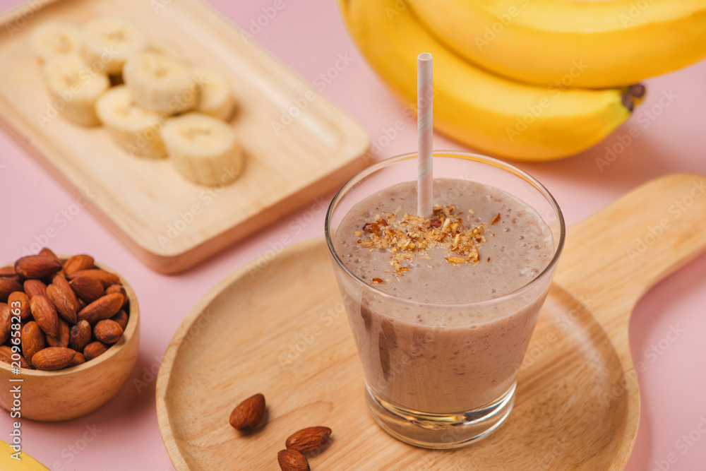 Fresh made Banana smoothie on pink background Fresh made Banana smoothie on pink background