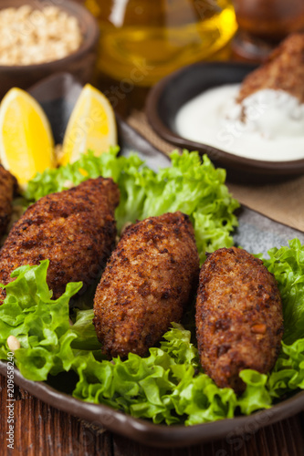 Traditional arabic kibbeh with lamb and pine nuts.