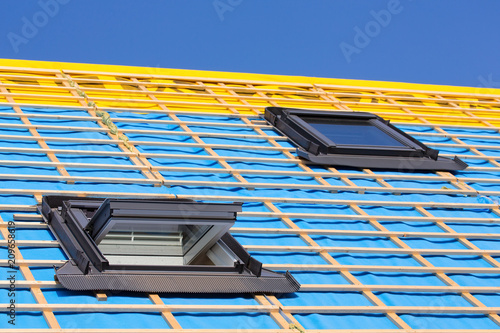 Foto Two roof windows on the roof of a new house