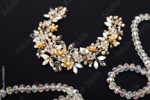 Wedding accessory, tiara for hairstyle, crystal detail on a dark background © Yana Mirta