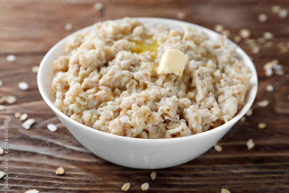 Tasty oatmeal in bowl on table Tasty oatmeal in bowl on table