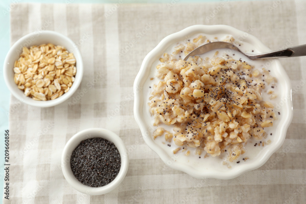 Composition with tasty oatmeal on table Composition with tasty oatmeal on table