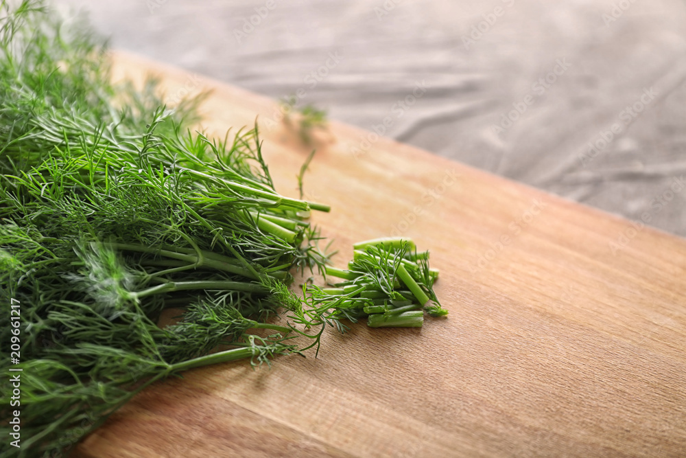 Fototapeta premium Board with fresh dill on table, closeup