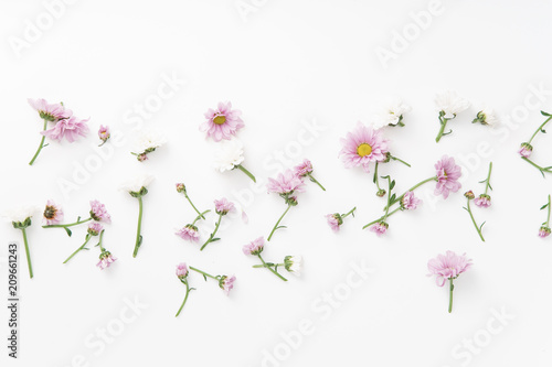 Floral pattern with tender pink and white flowers arranged as a flatlay on white background
