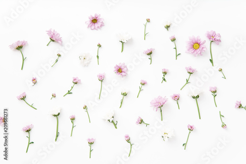 Fototapeta Naklejka Na Ścianę i Meble -  Floral pattern with tender pink and white flowers arranged as a flatlay on white background