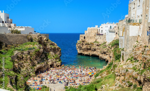 View of the beach lama monachile cala porto in the italian city Polignano. Polignano a Mare, Bari Province, Puglia, southern Italy. photo