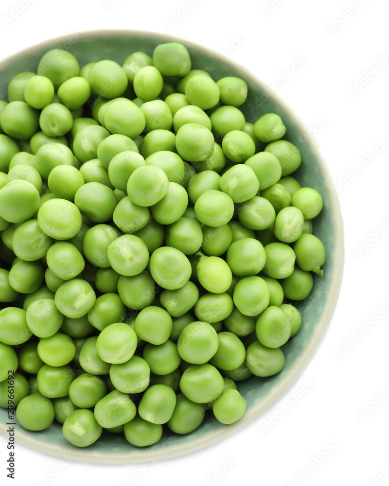 Bowl with green peas on white background, top view