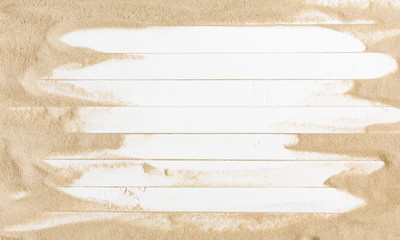 Sand on a white planked wood. Summer background. Flat lay, top view, copy space 