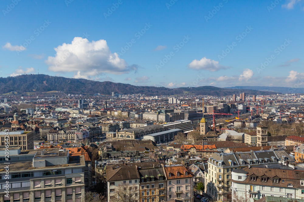 zurich city from above, central train station, houses, blue sky, clouds