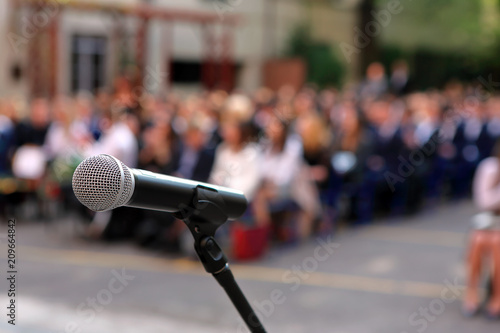 Fotótapéta Microphone and stand in front of graduation ceremony audience against a backgrou