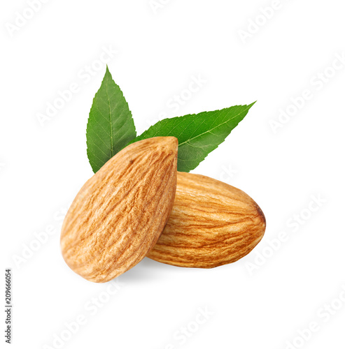 Almond and almond milk on a white background.