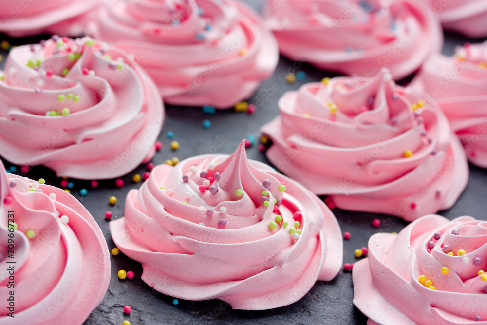 Homemade marshmallow, fluffy dessert zephyr, pink swirl meringue with colorful sugar sprinkles Homemade marshmallow, fluffy dessert zephyr, pink swirl meringue with colorful sugar sprinkles