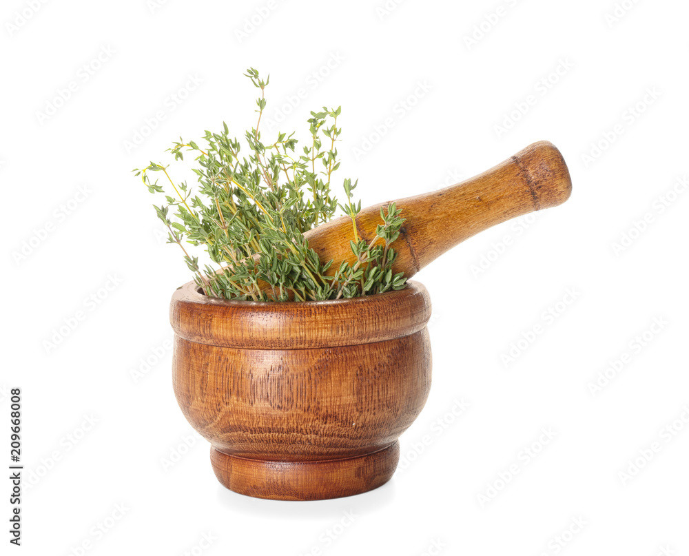 Mortar with fresh thyme on white background
