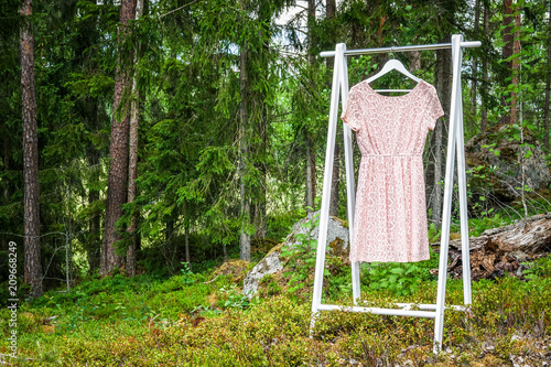 Clothes hanger with a pink ...