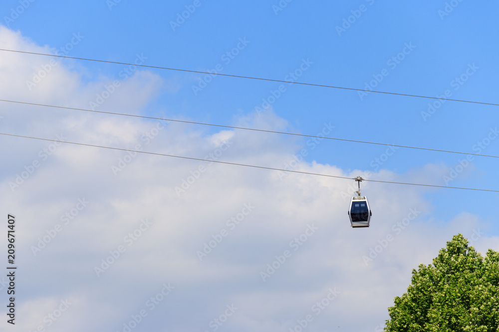 Cabin of the cable car against blue sky. Cableway in Tbilisi, Georgia Cabin of the cable car against blue sky. Cableway in Tbilisi, Georgia