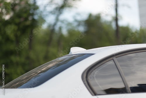 Antenna shark fin shape on a roof of car for radio © Mak