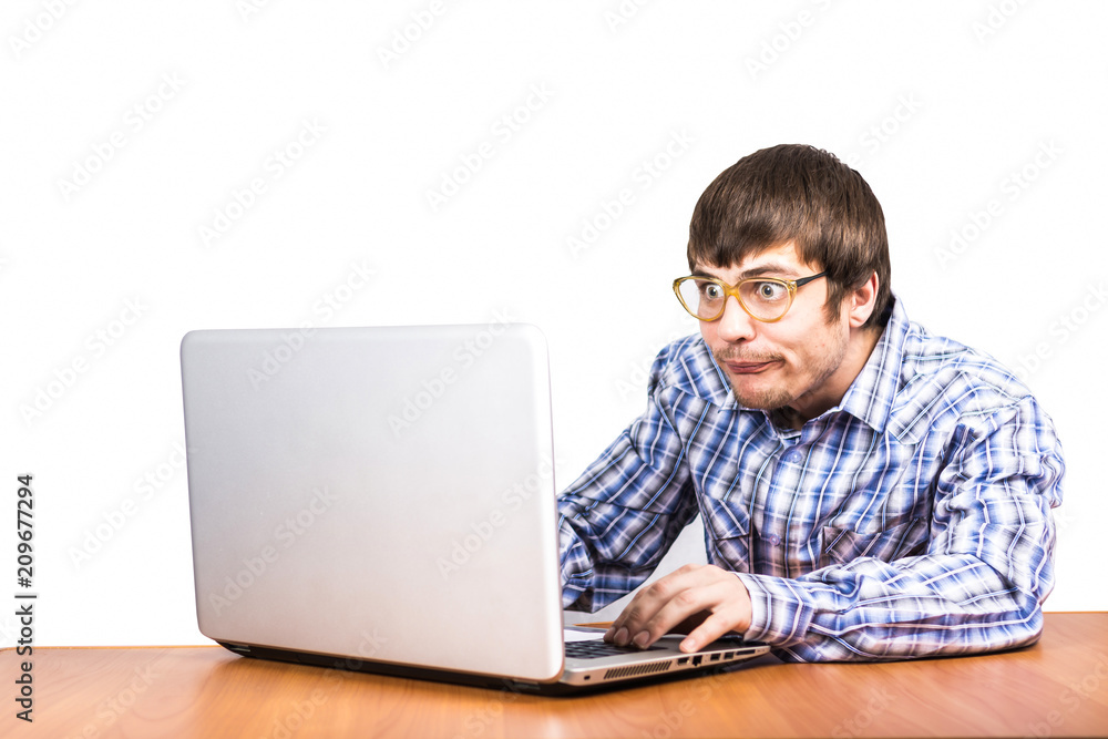 guy nerd works behind laptop Stock-Foto | Adobe Stock