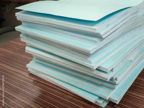 Wallpaper Mural Documents paper stack messy on the desk related to business functions. With selective focus Torontodigital.ca