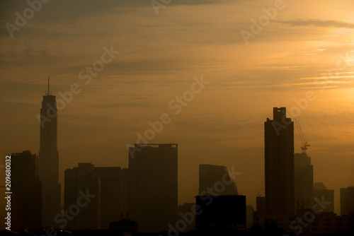 BANGKOK, THAILAND -  JANUARY 16, 2018 : Silhouette of Bangkok city view with beautiful sunrise background © joesayhello