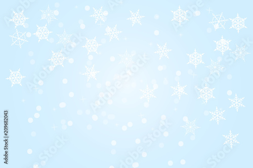 Blue winter abstract background. Christmas background with snowflakes and place for text