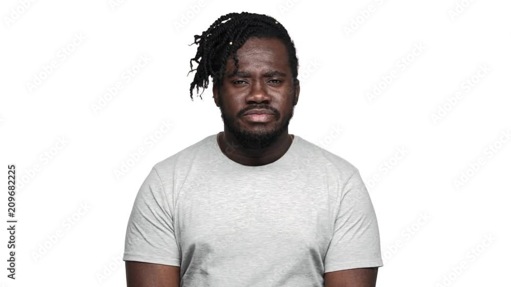 Portrait of amazed dark skinned guy with open mouth can't believe what happened and meaning it's unreal when shaking head, isolated over white background slow motion. Concept of emotions Portrait of amazed dark skinned guy with open mouth can't believe what happened and meaning it's unreal when shaking head, isolated over white background slow motion. Concept of emotions