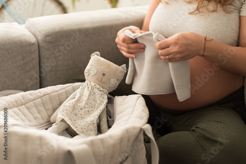 Pregnant woman packing maternity bag