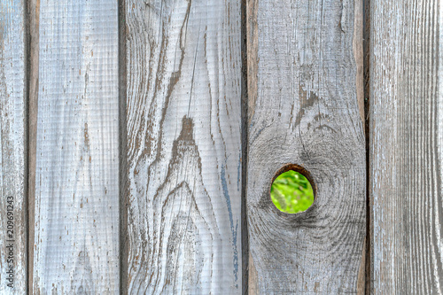 Obraz na plátně Wooden fence with a hole