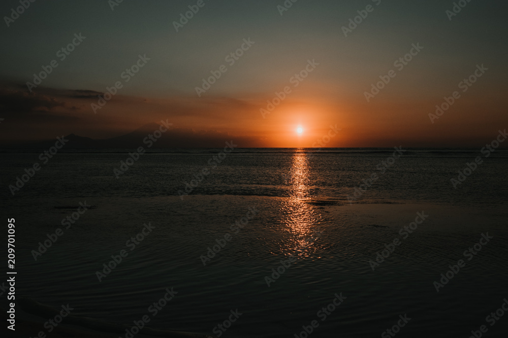 .Beautiful picture of the Gili Islands enjoying a colorful sunset in Indonesia. Photograph and vacation.