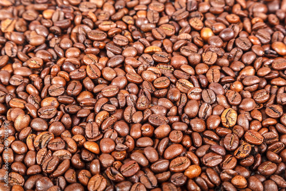 Fototapeta premium Grains of roasted coffee as a background