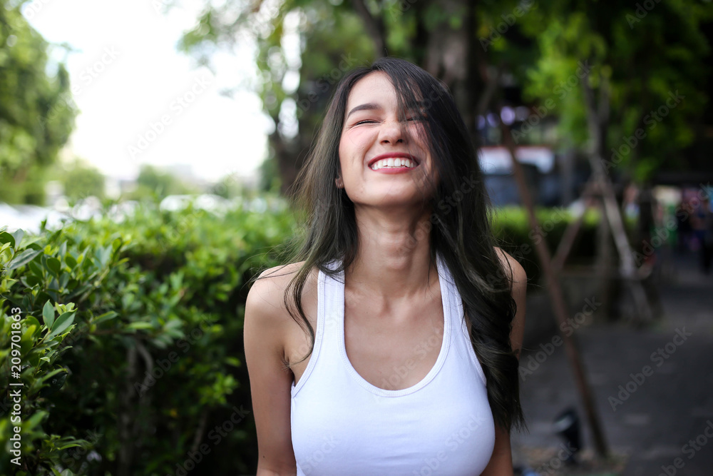 Pretty woman with natural beauty smiling at camera. Youth and happiness concept. Pretty woman with natural beauty smiling at camera. Youth and happiness concept.