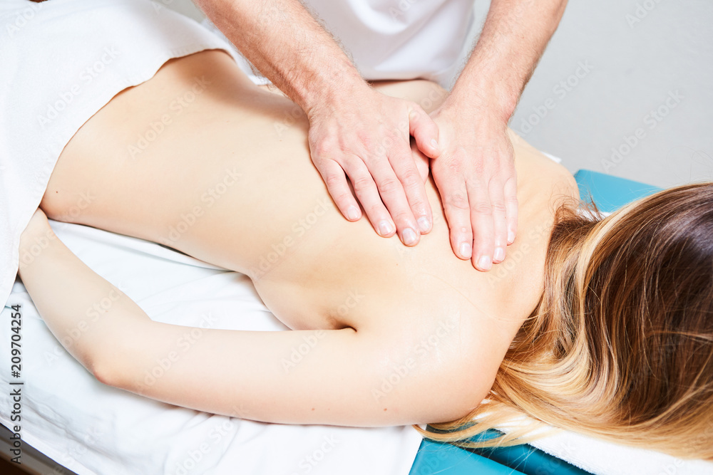 pretty woman or girl with sexy body and male hands of masseur therapist  makes massage in beauty spa salon Stock Photo | Adobe Stock