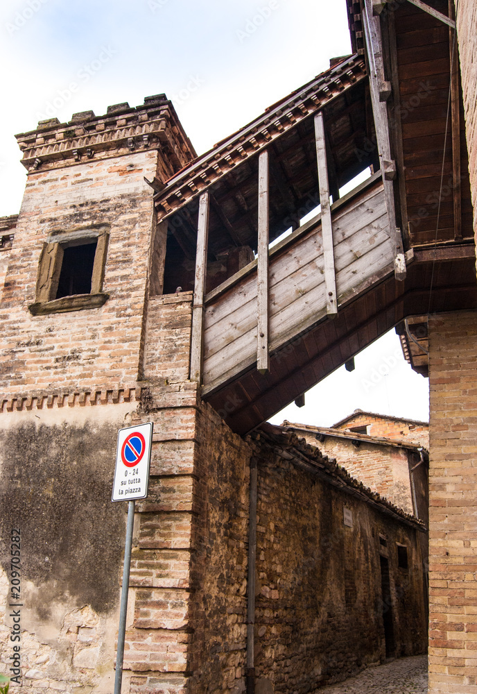 Covered gangway between houses  in a little town in the Umbria region