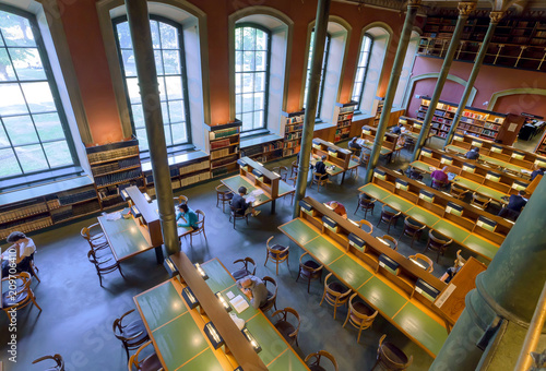 Photography Reading and stading people inside the beautiful National Library of Sweden