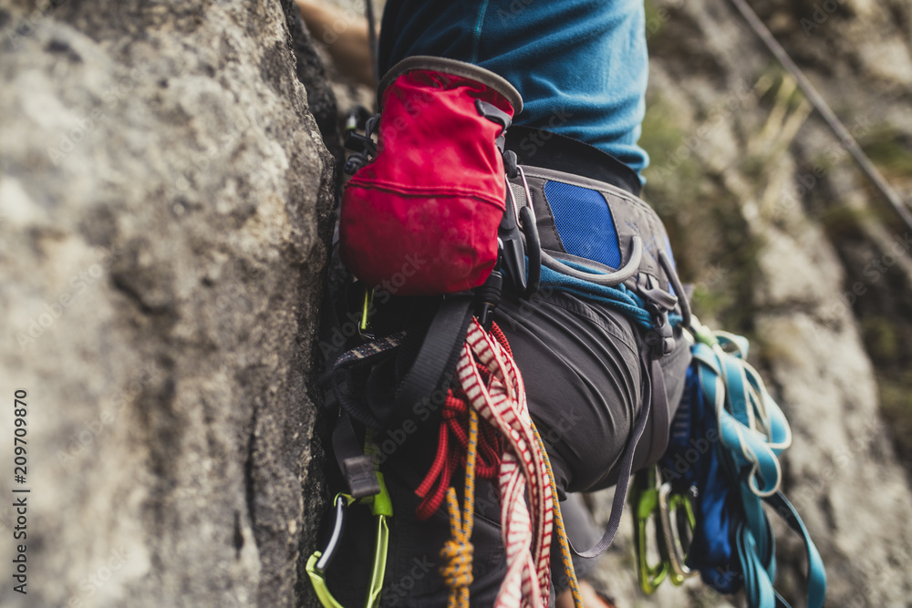 Fototapeta premium Mountaineer Climbing a Rock